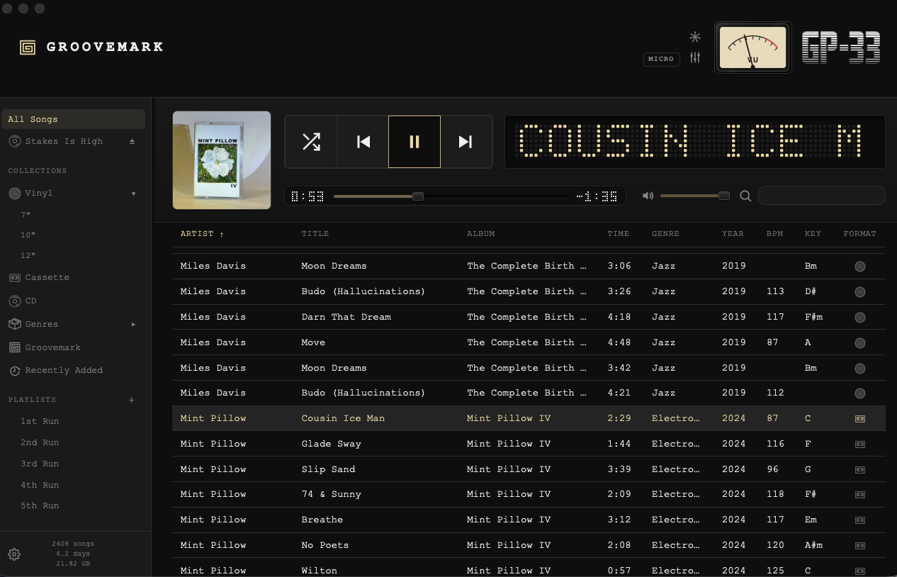GP-33's full player: an album playing, the library below it with BPM, key and format columns